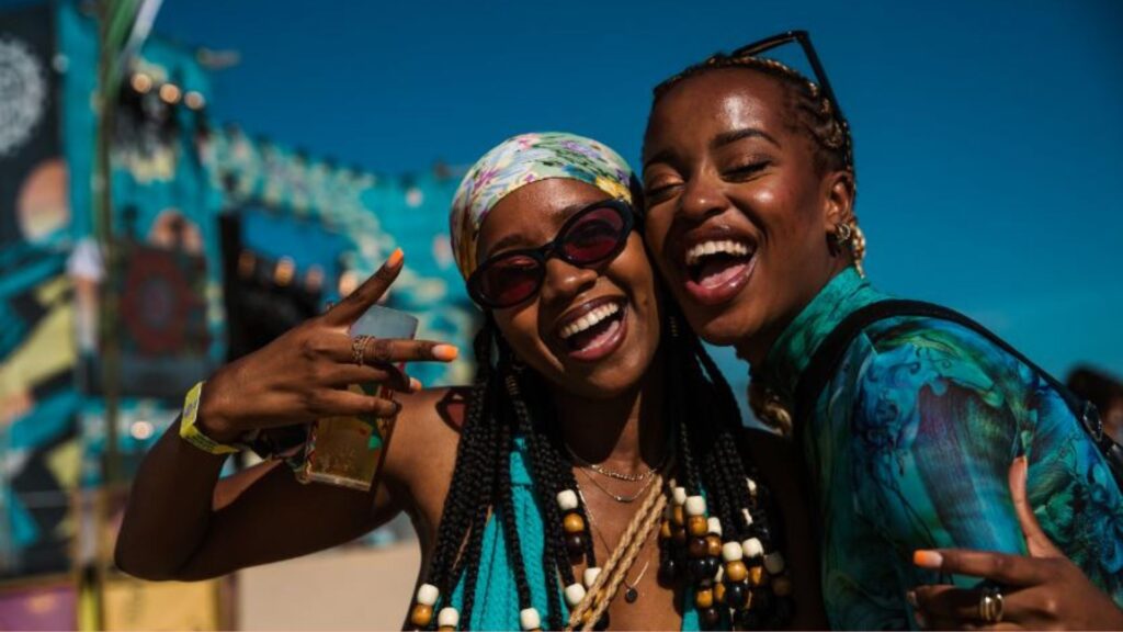 Two girls posing for a Detty December celebration photo