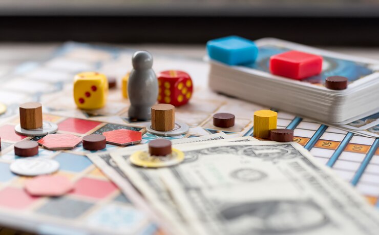 board-games-coins-bills-dice-cards_147448-169