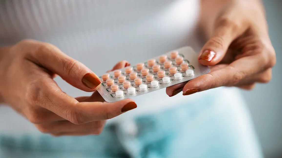 female-holding-birth-control-pack-1296-728-header