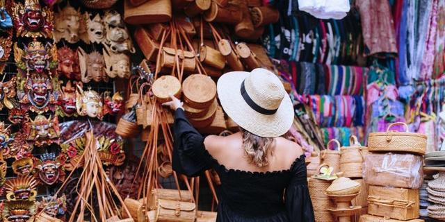 picture showing an admirer of unique art works at an art stall in Jakande market