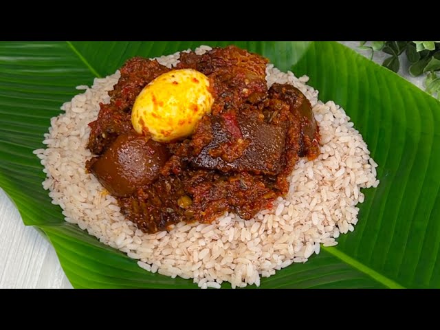 Picture showing Ofada rice and stew, a Nigerian Christmas delicacy