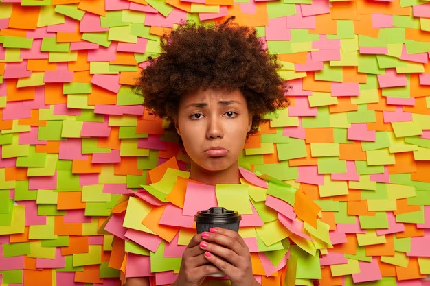 picture showing woman covered in stick it notes