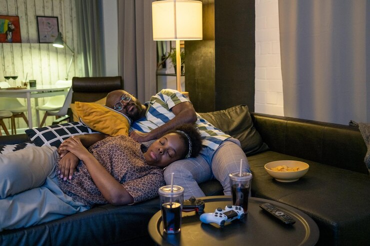 picture showing a couple falling asleep while watching netflix as a show of romance in parenting