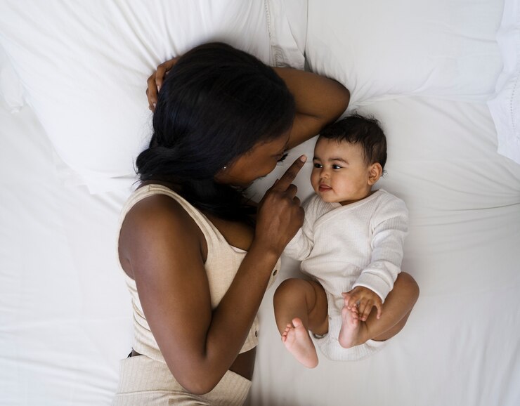 picture showing mama staying up late to take care of baby as a show of romance in parenting