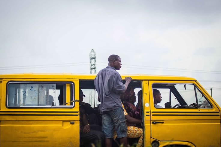 Bus and a conductor with passengers