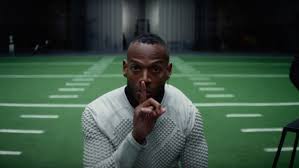 picture showing a young man on an American football field
